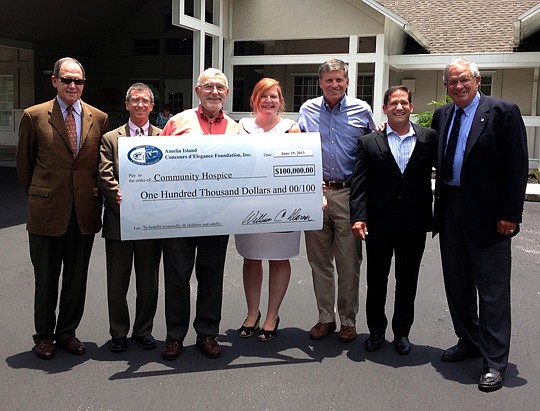 The Amelia Island Concours d'Elegance Foundation Inc. presented a check for $100,000 to Community Hospice of Northeast Florida. From left, John Duss, Mark Becker and Maury Pilver, Amelia Island Concours board members; DeAnn Collins, Community Hospice ...