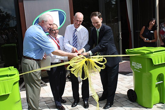 Photo by Joe Wilhelm Jr. - From left, Jay Morris, St. Johns County Board of County Commissioners chair, Charlie Appleby, Advanced Disposal chairman and CEO, Gov. Rick Scott and state Rep. Lake Ray cut the ribbon Monday on the new Ponte Vedra headquart...