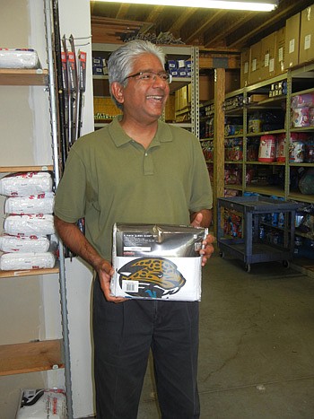 Photo by Karen Brune Mathis - Store51 LLC CEO Murali Vadakkemadhom shows one of the 3,000 themed bedding and room dÃ©cor items he sells online from his EastPark office-warehouse units. He holds the former version of the Jacksonville Jaguars logo; the ...