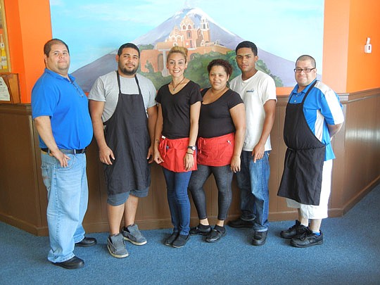 (from left) Henry Sepulveda, cook Nelson Zayas, waitresses Miriam Garcia and Millie Hernandez (also a dessert chef), dishwasher Julio Torres and prep worker Macklyn Sepulveda, Henry\'s brother.