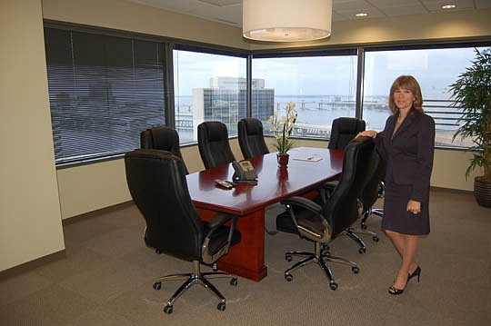 Photos by Max Marbut - Executive Suite Professionals co-founder and managing member Lisa Gufford in the "River View Room" on the 14th floor at EverBank Center.