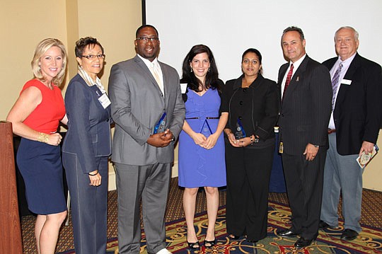 The Exchange Club raised more than $75,000 at its annual conference for the Exchange Club Family Center. Pictured from left, Jennifer Waugh, WJXT TV-4 news anchor; Prudence Williams, Exchange Club Family Center of Northeast Florida program director; D...