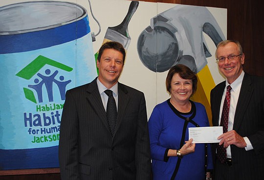 From left, JPMorgan Chase &amp; Co. Senior Vice President of Middle Marketing Banking Robert Dilts, HabiJax President and CEO Mary Kay O'Rourke and JPMorgan Chase Jacksonville Market Leader Michael Butler.
