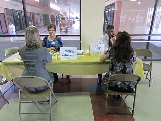Pro bono attorneys Tess Arington and Reese Marshall provide assistance at an Ask-A-Lawyer event.