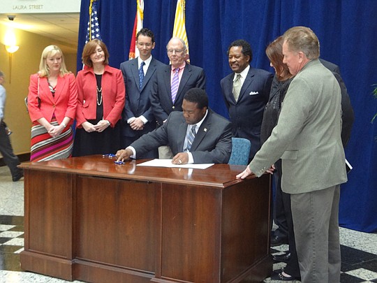 Surrounded by Downtown advocates, Mayor Alvin Brown signed legislation in March establishing a $9 million fund for Downtown economic development.