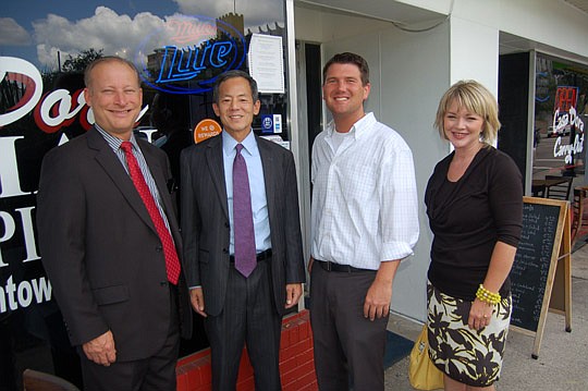 Photos by Max Marbut - From left, Community First Credit Union Vice President of Marketing Roger Rassman, CEO and President John Hirabayashi, Jax Cash Mob founder Mike Field and Missy Peters, Community First community affairs manager were among the fi...