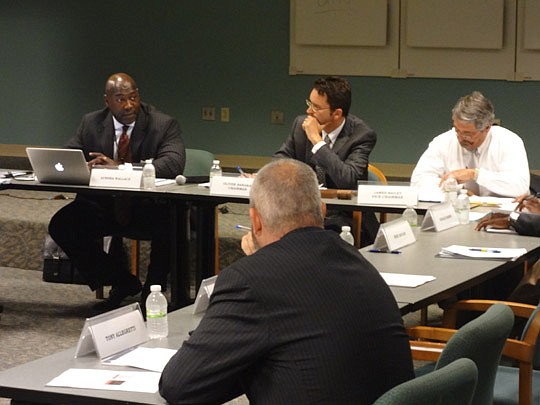 Downtown Investment Authority CEO Aundra Wallace (left) address board Chair Oliver Barakat, Vice Chair Jim Bailey and others during his first authority meeting.