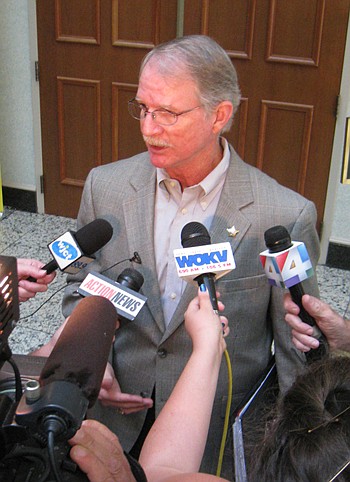 Photo by David Chapman - Sheriff John Rutherford talks to the media after a City Council subcommittee approved restoring $27 million to his budget for the coming year. Without the influx, Rutherford said he would have had to lay off more than 300 poli...