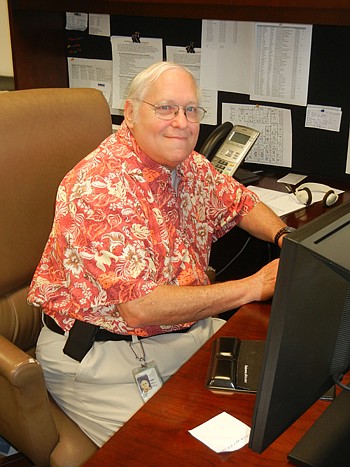 Photo by Karen Brune Mathis - Jim Schock, chief building official with the city, and his staff wore Hawaiian shirts Friday to celebrate his retirement.