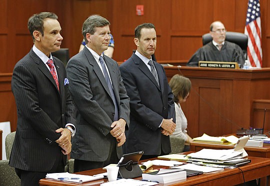 AP Photo/John Raoux, Pool Photo - The trial of Jacksonville attorney Kelly Mathis, center, began Thursday in Seminole County. Mathis is accused of being the "mastermind" of a $300 million illegal gambling operation. His attorneys say Mathis offered on...