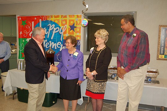Photo by Max Marbut - From left, Duval County Tax Collector Michael Corrigan, Freida Andriesse, Willie Swearingen and Alvin Crooms at a retirement celebration Friday at the Yates Building.