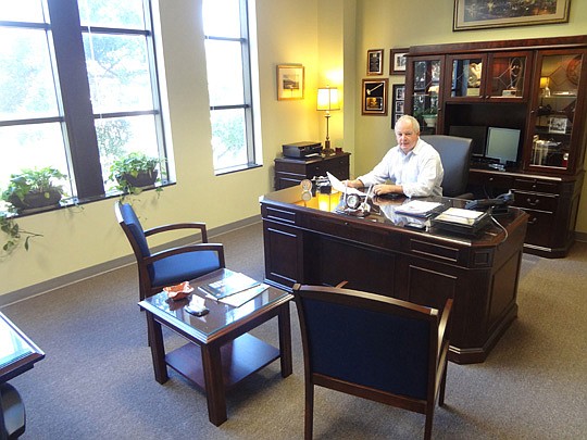 Photo by David Chapman - Tax Collector Michael Corrigan won't set your property tax rate this year. He's just the one in charge of collecting the property tax payments along with fees for driver's licenses and other services. Once the City Council has...