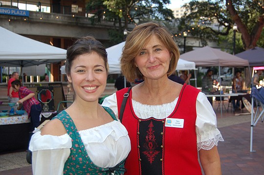 From left, Downtown Vision Inc. Director of Marketing Katherine Hardwick and Executive Director Terry Lorince were dressed up in the spirit of First Wednesday Art Walk: Oktoberfest in Hemming Plaza.