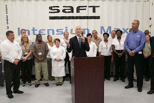 Gov. Rick Scott talks with employees of Jacksonville manufacturer Saft America during a visit Tuesday morning. Scott was at the plant to highlight the removal of the tax on manufacturing equipment.
