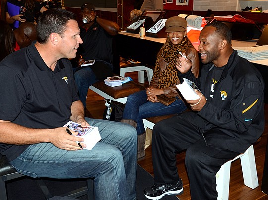 Photos courtesy of Rick Wilson / Jaguars - Jaguars legends Tony Boselli and Fred Taylor (above) take a break while signing autographs at Nike Town in London. The Jacksonville Jaguars will play San Francisco on Sunday. Next year, they will play the Dal...