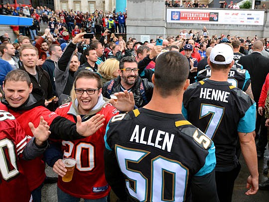 Photos courtesy of Rick Wilson/Jacksonville Jaguars  - Jacksonville players are greeted by fans, even 49ers fans, as they make their way through the crowd at the Trafalgar Square rally.