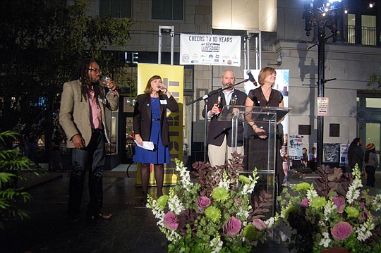 From left, artist Al Letson, Cultural Council of Greater Jacksonville board Chair Diane Brunet-Garcia, JAX Chamber Director of Downtown Engagement Anthony Allegretti and Downtown Vision Inc. Executive Director Terry Lorince toast the 10th anniversary ...