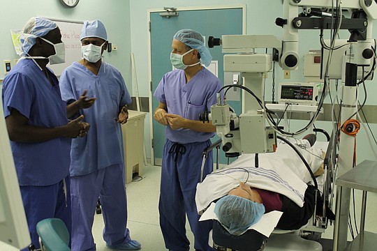 Jacksonville ophthalmologist Jeff Levenson discusses cataract surgery with (from left) Dr. Jeremie Agre of Abidjan, Ivory Coast, and Dr. Michael Ketema of Conakry, Guinea. Agre, Ketema and two other African ophthalmologists came to Jacksonville this w...