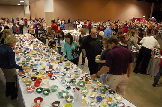 More than 1,000 people selected a handmade ceramic bowl before sitting down for a simple meal Tuesday at the 29th Annual Empty Bowls Luncheon. The bowls are made and donated each year by students, seniors and potters.