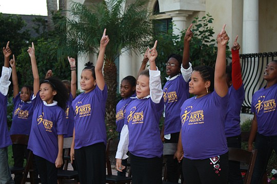 Cathedral Arts Projects students from Sadie Tillis Elementary perform outside the Ponte Vedra Beach home of Frank and Marisa Martire.