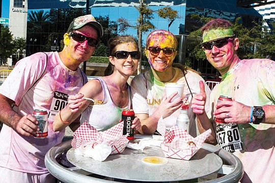 Andrew and Casi Conk, Lesley Caron and Joshua Dowdle came to the Food Truck Rally on Saturday morning in front of the Jacksonville Landing after participating in the Run or Dye event at EverBank Field.