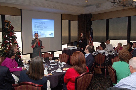 From left, Jen Jones and Cynthia Farmer reviewed the annual JAX Chamber Leadership Trip Friday for the chamber's Downtown Council.