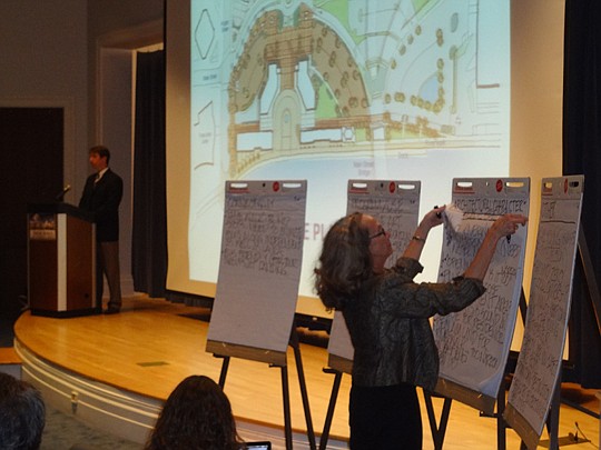 Downtown Investment Authority board member Melody Bishop serves as note-taker during Monday's public input session on changes for the Landing. Tom Hurst (at podium), AIA Jacksonville president, moderated the comment session.