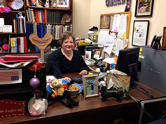 Photo by Carole Hawkins - Carol Whitman runs the Jacksonville Symphony Orchestra's library, but also has her own office in the building. Here she keeps her personal items and completes her administrative tasks.
