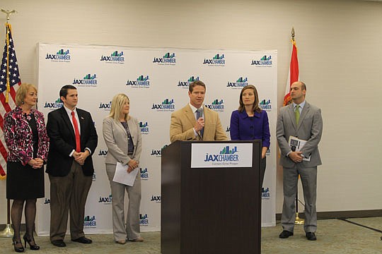 JAX Chamber President Daniel Davis (at podium) said at a Thursday news conference that his agency will partner with Duval County Public Schools to find opportunities for students and teachers with businesses. Also pictured are (from left) school board...