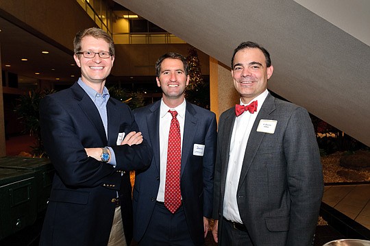Photos by Jeff Westcott - John Benton, James Cummings and Braxton Gillam, president of The Jacksonville Bar Association, were among the guests at Thursday's  annual Bench and Bar holiday party at the Wells Fargo Center.