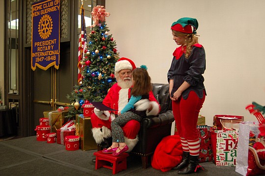 Photos by Max Marbut - Santa Claus arrived Downtown on Monday for a visit with the Rotary Club of Jacksonville.