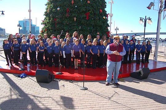 Choral Director Ben Norman and the chorus from Lake Asbury Elementary School.