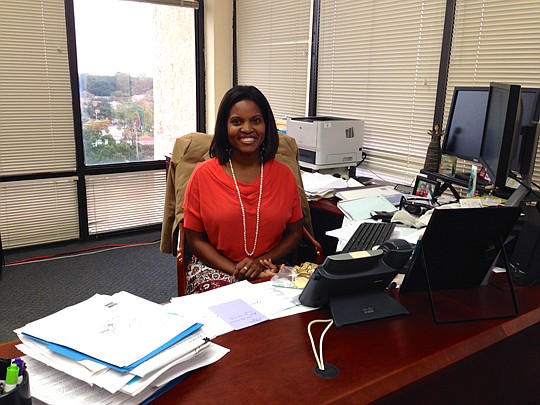Dr. Kelli Wells sits at her desk on the seventh floor of the Duval County Health Department's University Boulevard office. Wells has led the department since May.