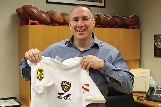 Photo by Carole Hawkins - As the Jacksonville Jaguars Foundation president, Peter Racine coordinates the team's philanthropic activities. For its Honoring Our Troops program, the foundation donates more than 100 tickets to home games to local families...