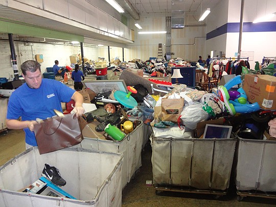 Goodwill Industries of North Florida often sees an uptick in end-of-year giving. Drew Vetter, manager of the Mandarin store, unloads bins of donated goods on New Year's Eve, which tends to be the busiest day of the year.