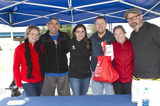 Members of the winning team (starting second from left) Jason Mente, Lauren Mente, Joel Garrison and Camille Garrison are flanked by Missy Peters of Community First Credit Union and Tony Allegretti, the JAX Chamber\&#039;s director of downtown engagement.