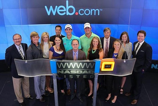 One of Web.com Group Inc.'s new marketing initiatives is sponsoring the PGA Tour's second-level tour, which is branded the Web.com Tour. CEO David Brown (front, center) and a group of golfers rang the close bell at Nasdaq in October.