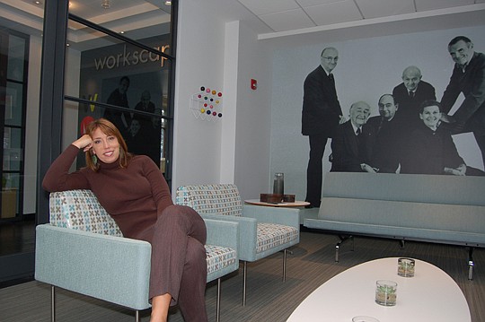 Sarah Bermudez, sales director of Workscapes Jacksonville, in the company's "living room" at the showroom at 121 W. Forsyth St.