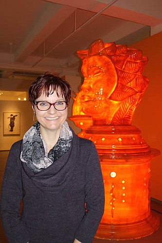 Photo by Carole Hawkins - Denise Reagan left a career in journalism to take on the duties as communications director for Museum of Contemporary Art Jacksonville. Reagan is standing in front of a piece from the museum's permanent collection called Aiza...