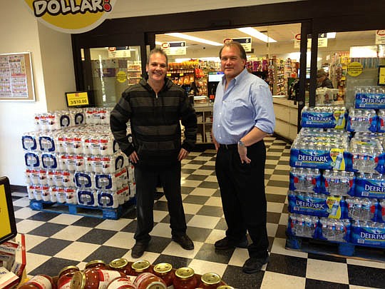 Rowe's IGA Express Manager Dave Peicott and owner Rob Rowe opened the Baldwin store Dec. 30. "This is a feel-good store. They just love it," Rowe said of the customers.