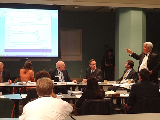 Bill Scheu (standing), Jacksonville Retirement Reform Task Force chair, asks a question Wednesday about a presentation.