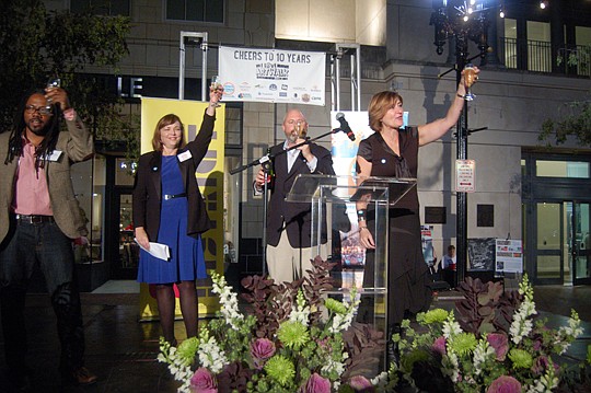From left, Cultural Council of Greater Jacksonville board chair Diane Brunet-Garcia, JAX Chamber Director of Downtown Engagement Anthony Allegretti and Downtown Vision Executive Director Terry Lorince raise a toast to the 10th anniversary of First Wed...