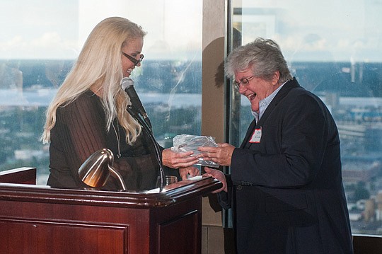Ann Finnell, right, receives the award for being named Jacksonville Women Lawyers Association's Lawyer of the Year from outgoing President Susannah Collins. Finnell, a past president of JWLA, is with Finnell, McGuinness, Nezami &amp; Andux. The crimin...