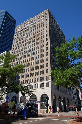 In 2013,  developer Stephen Atkins bought The Barnett Bank building  with a loan from Stache Investments. Stache foreclosed on the property in 2013.