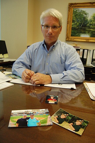 Pajcic & Pajcic partner Tom Slater keeps photos in his office of trips he took over the years to Major League Baseball parks around the country with his son, Austin, whoâ€™s playing for the San Francisco Giants.