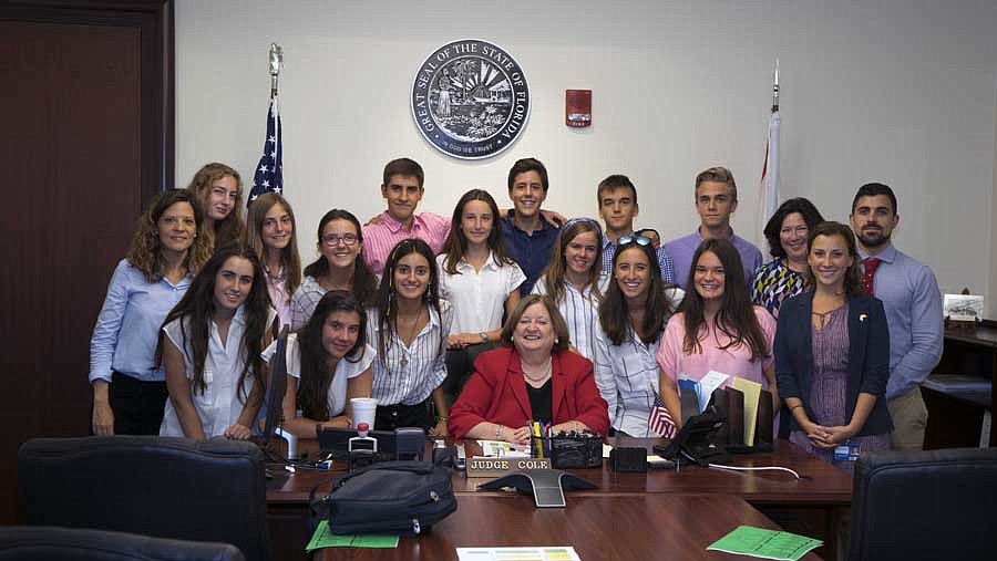 Circuit Judge Karen Cole with exchange students from The Bolles School who went on a tour of the Duval County Courthouse.