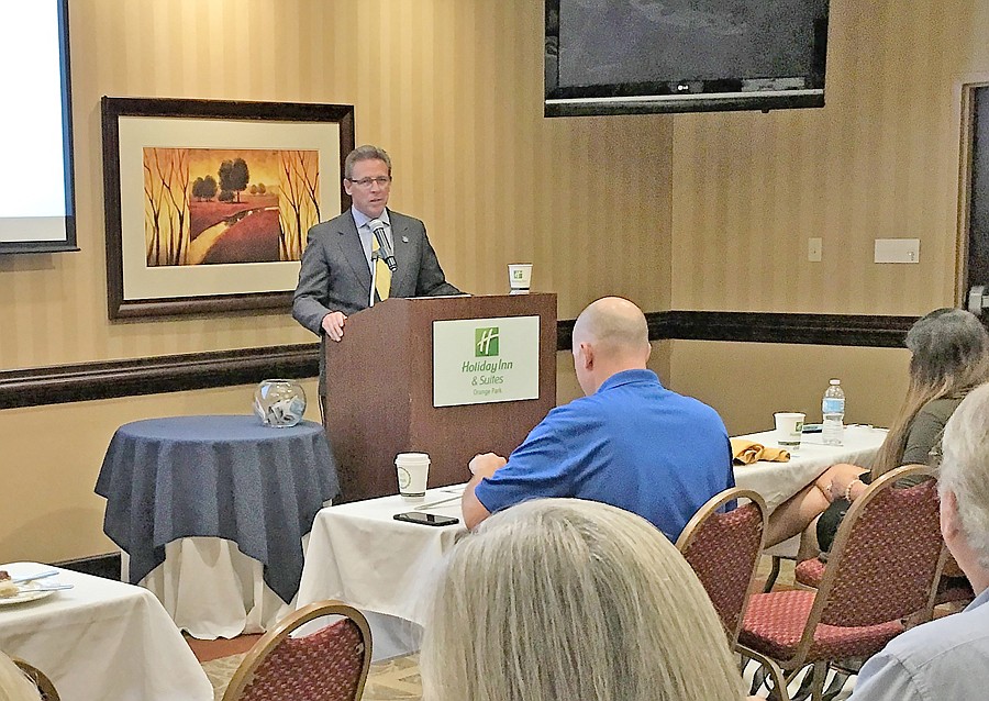 Bill Garrison, president of Clay Florida Economic Development Corp., presents an update on the agencyâ€™s work. The program was attended by about 120 members of the Northeast Florida Association of Realtors.