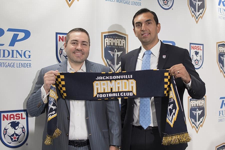Robert Palmer, CEO of the Robert Palmer Companies, and Rishi Sehgal, NASL interim commissioner, at a news conference Tuesday where they announced Palmer bought the Jacksonville Armada FC.