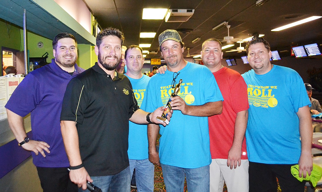 Greenâ€™s Quality Construction captured the tournament trophy: Nick Hyzer, Peter Helton, Chad Friedmann, Mike Greene, Doug Abel and Rob Lampke. Helton is chairman of the Remodelers Council.