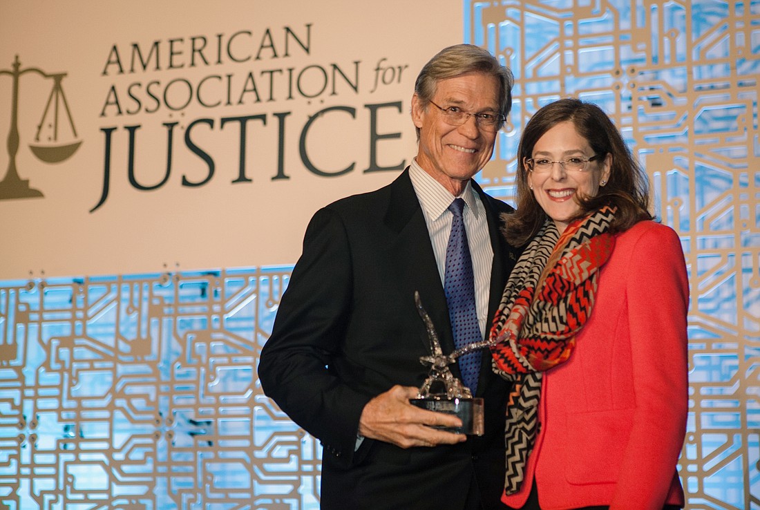 Wayne Hogan was presented the American Association for Justice 2017 Lifetime Achievement Award by Julie Braman Kane, immediate past president of the association.